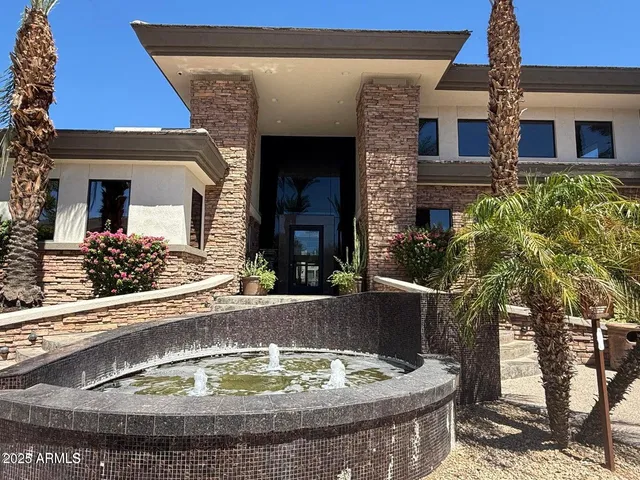 a view of a house with a small yard