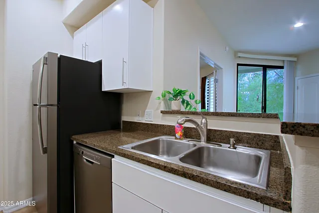 a bedroom with a bed and a lamp