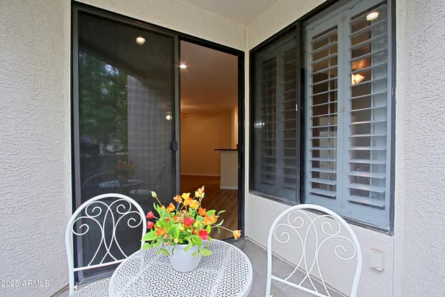 a bedroom with furniture and a rug