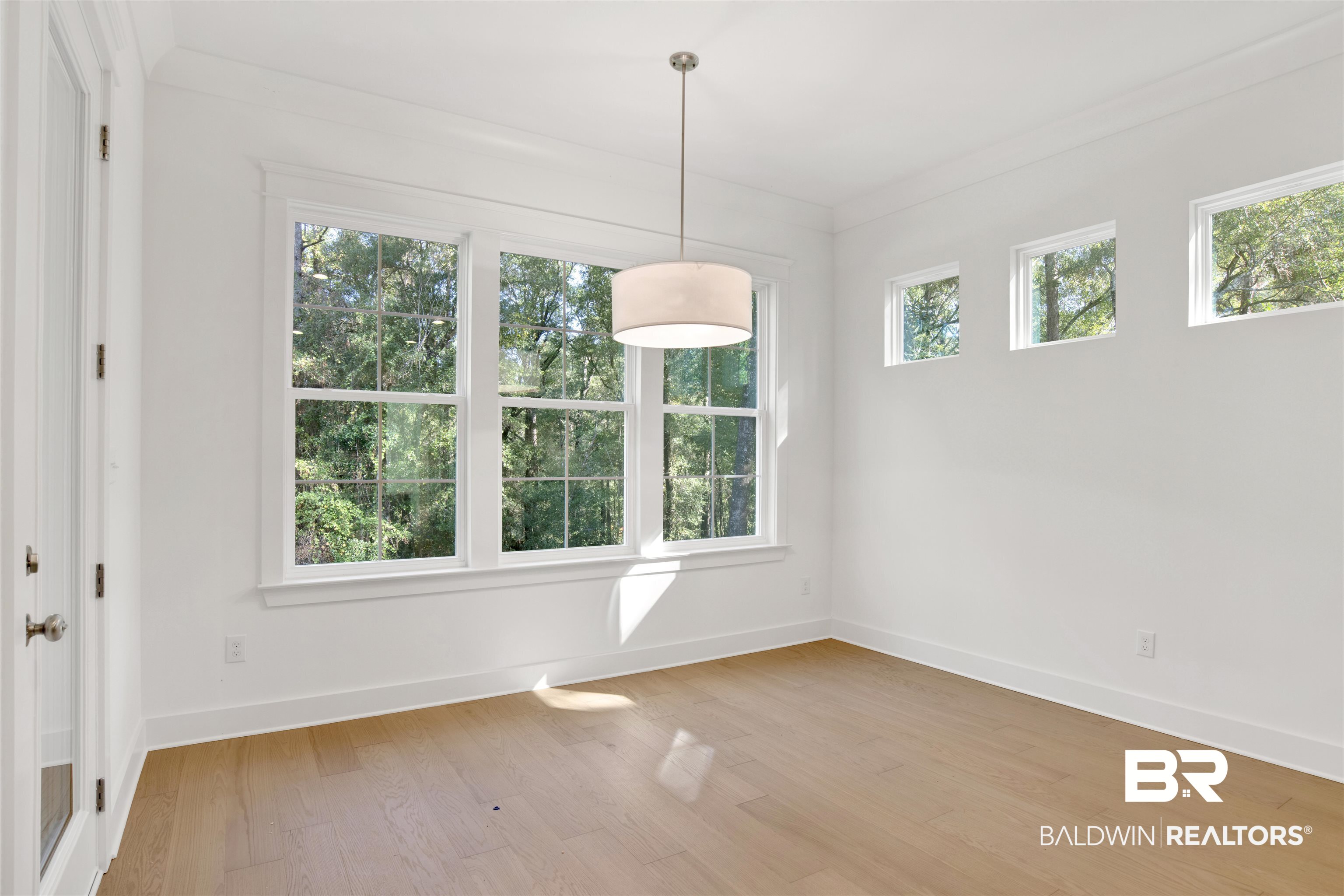 5 Long Leaf Circle Fairhope, AL 36532 - Photo 13 of 44 Interior space with light hardwood / wood-style flooring and crown molding
