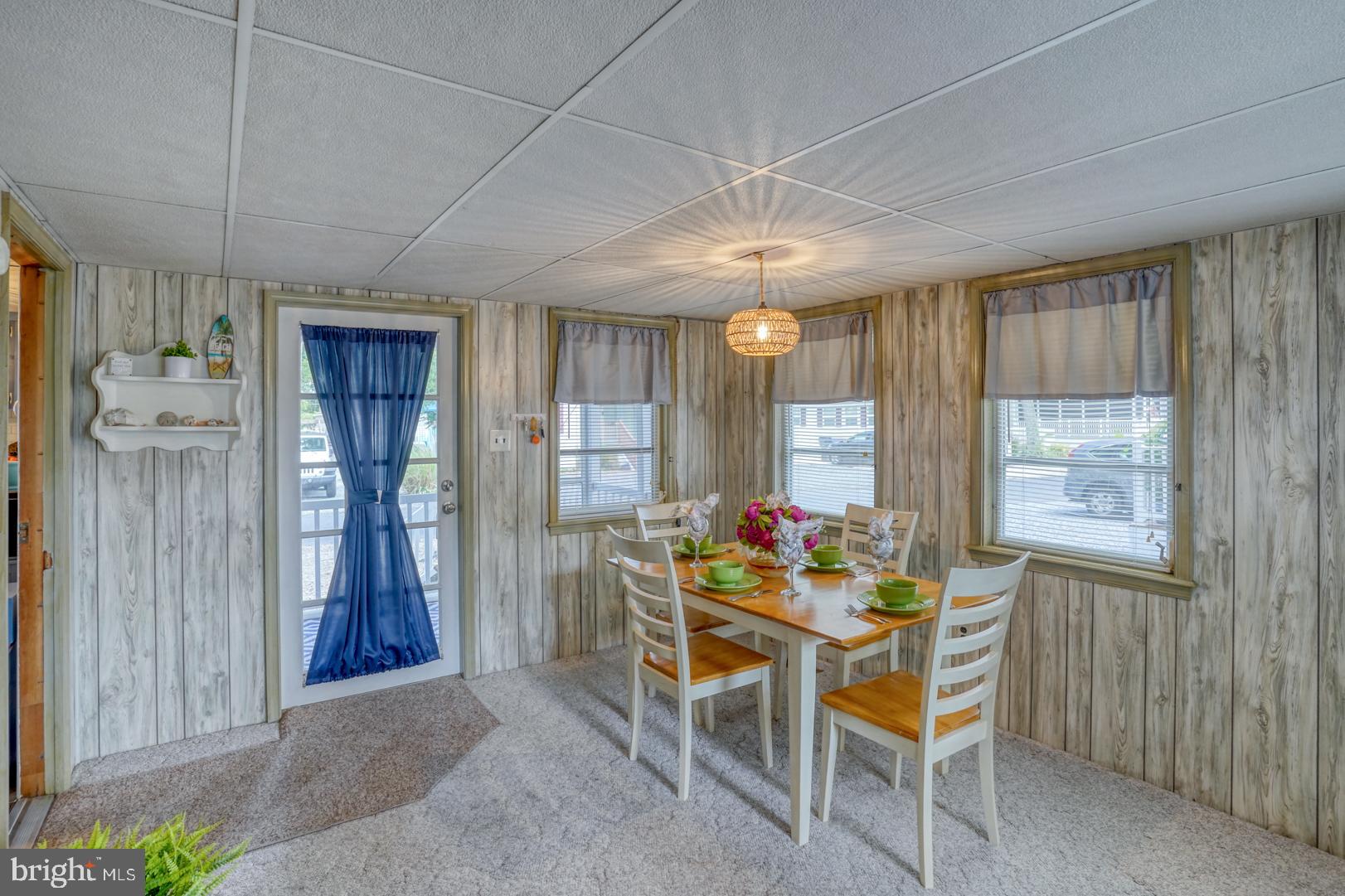 25780 Blue Ridge Street, Unit 4198 Millsboro, DE 19966 - Photo 13 of 36 a dining room with furniture and window