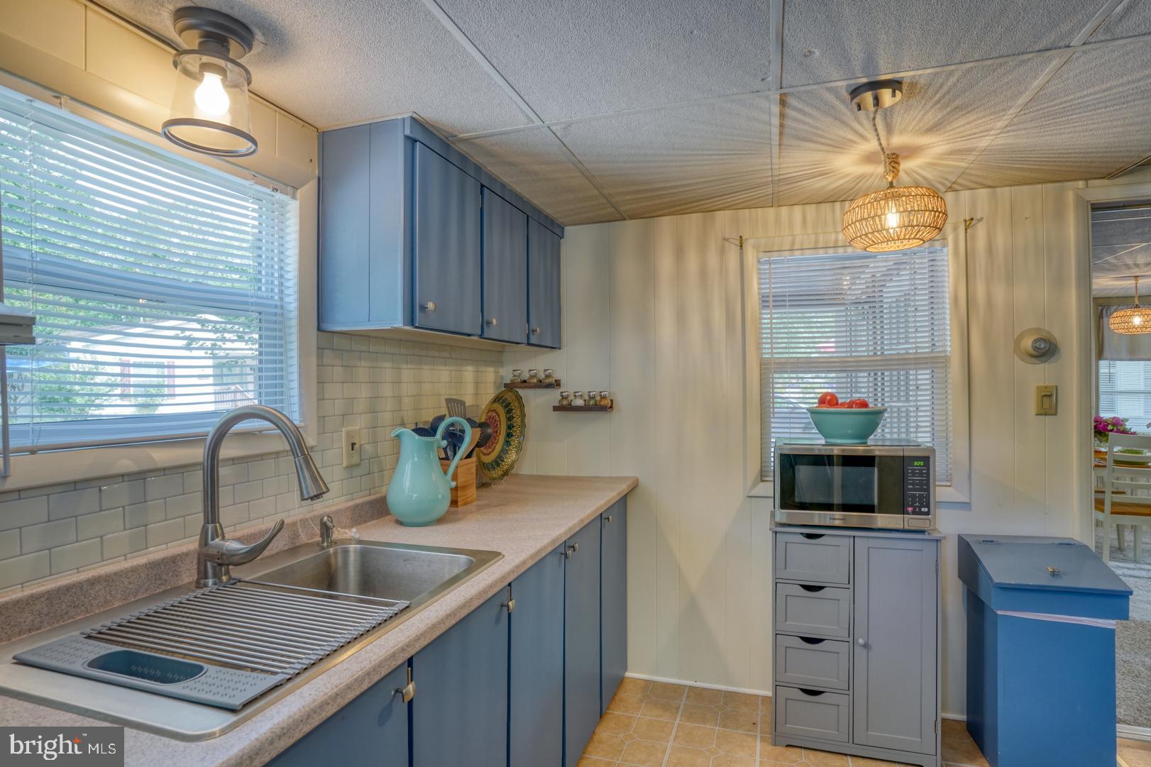 25780 Blue Ridge Street, Unit 4198 Millsboro, DE 19966 - Photo 20 of 36 a kitchen with sink and cabinets