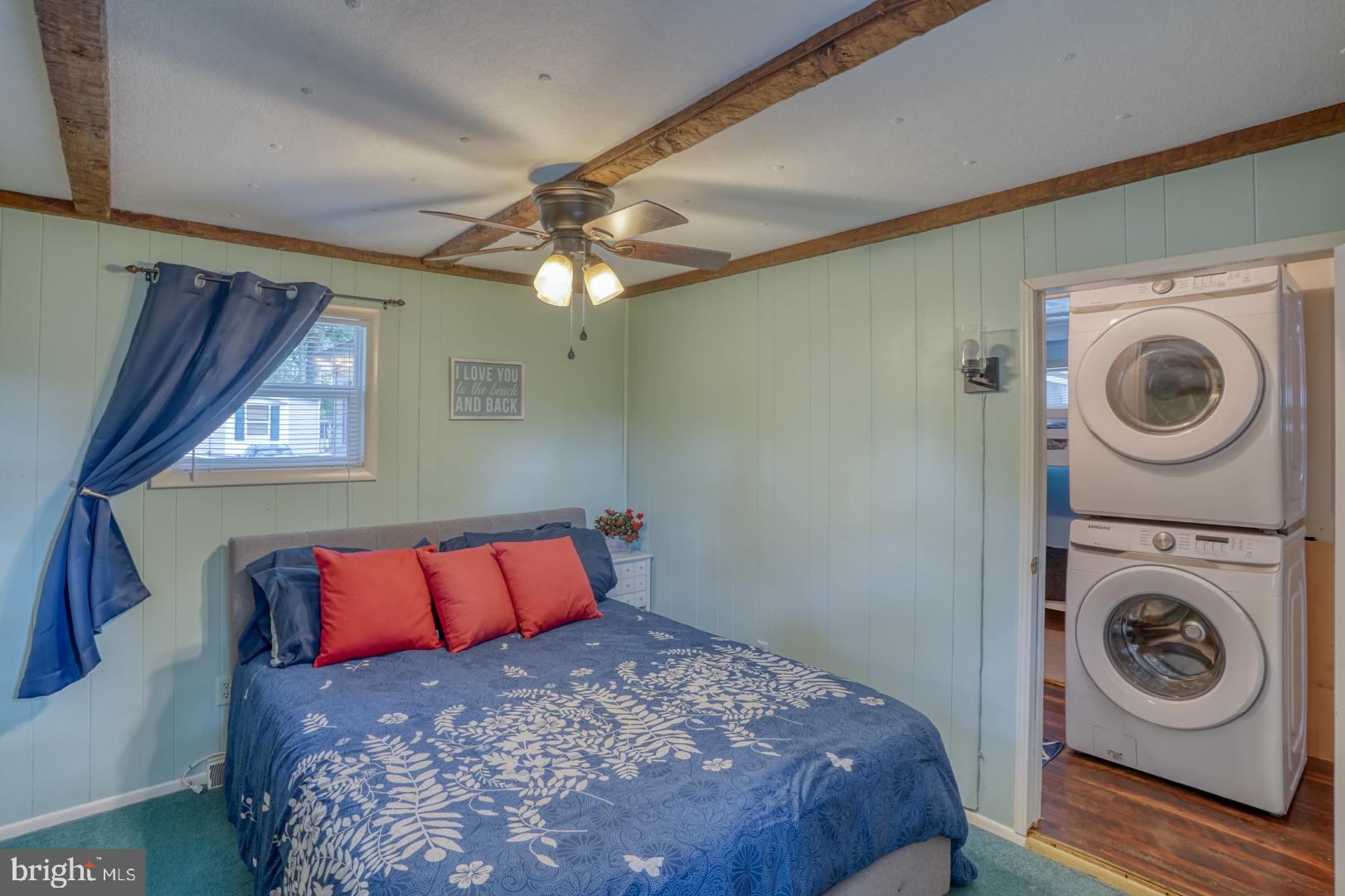 25780 Blue Ridge Street, Unit 4198 Millsboro, DE 19966 - Photo 24 of 36 a bedroom with a bed and a window
