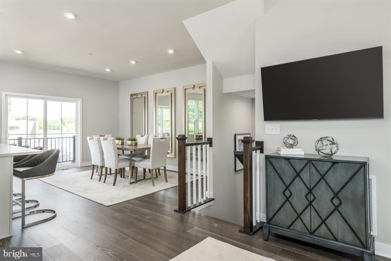 19756 Canopy Loop, Unit 328D Montgomery Village, MD 20886 - Photo 13 of 27 a living room with furniture and a flat screen tv