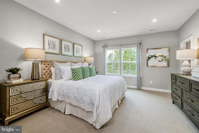 19756 Canopy Loop, Unit 328D Montgomery Village, MD 20886 - Photo 16 of 27 a bedroom with a bed and a window