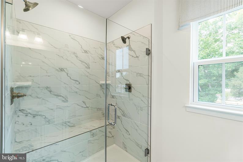 19756 Canopy Loop, Unit 328D Montgomery Village, MD 20886 - Photo 18 of 27 a bathroom with a shower