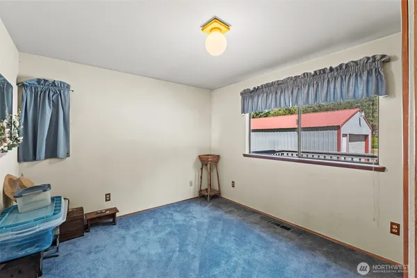 a utility room with dryer washer and a window