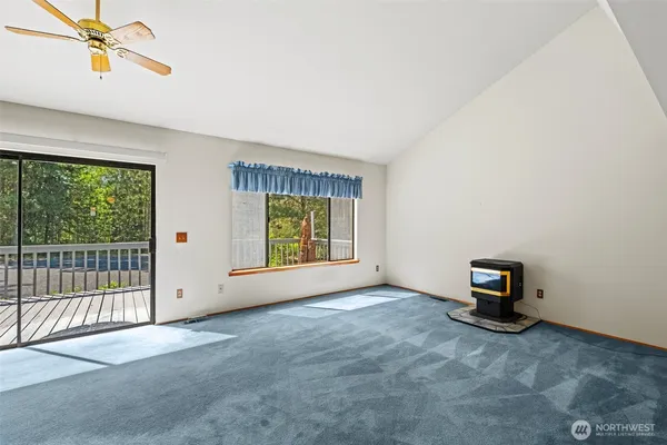 a view of an empty room with stairs