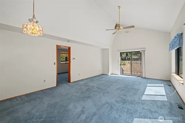 a view of n empty room with a window