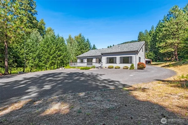 a view of house with outdoor space and porch