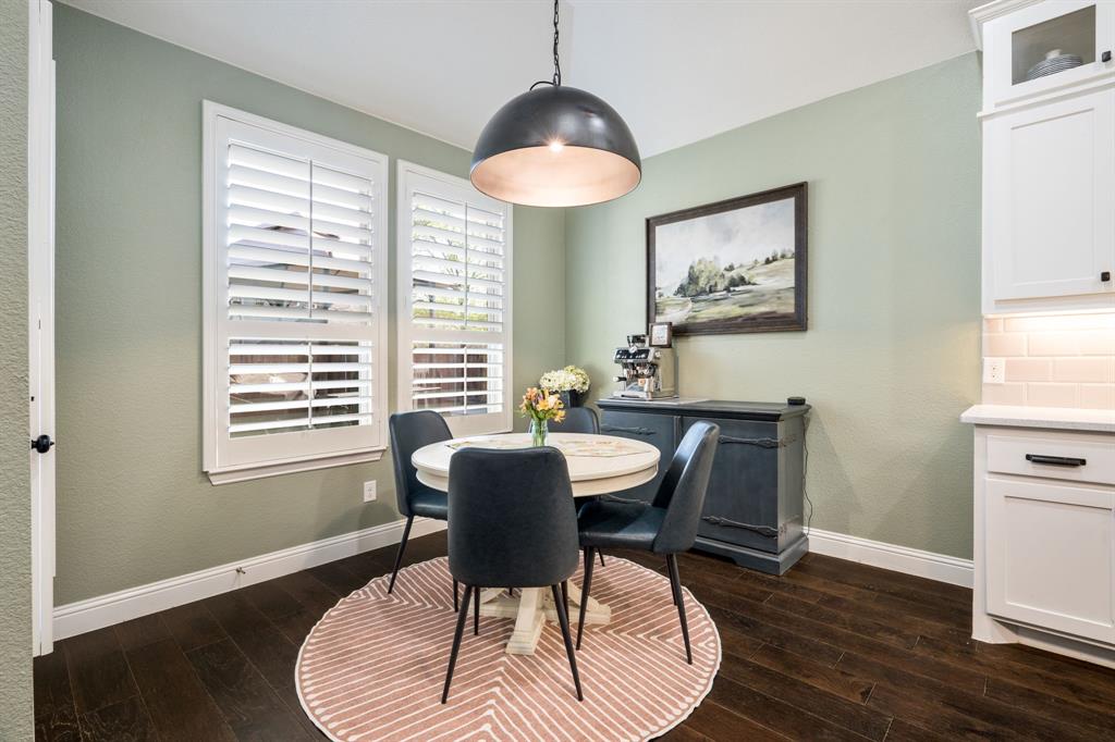 1501 Snowdrop Drive Prosper, TX 75078 - Photo 15 of 27 a dining room with furniture and wooden floor