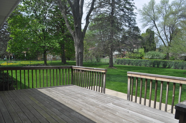 968 Hillcrest Road Elgin, IL 60123 - Photo 9 of 13 a view of deck with wooden floor and fence