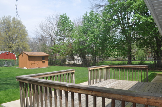 968 Hillcrest Road Elgin, IL 60123 - Photo 10 of 13 a view of a wooden deck with a big yard