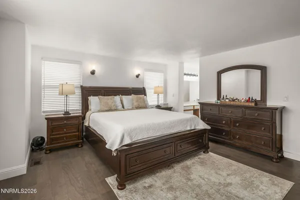 a bedroom with a bed and a dresser
