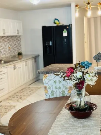 an aerial view of a house with a swimming pool