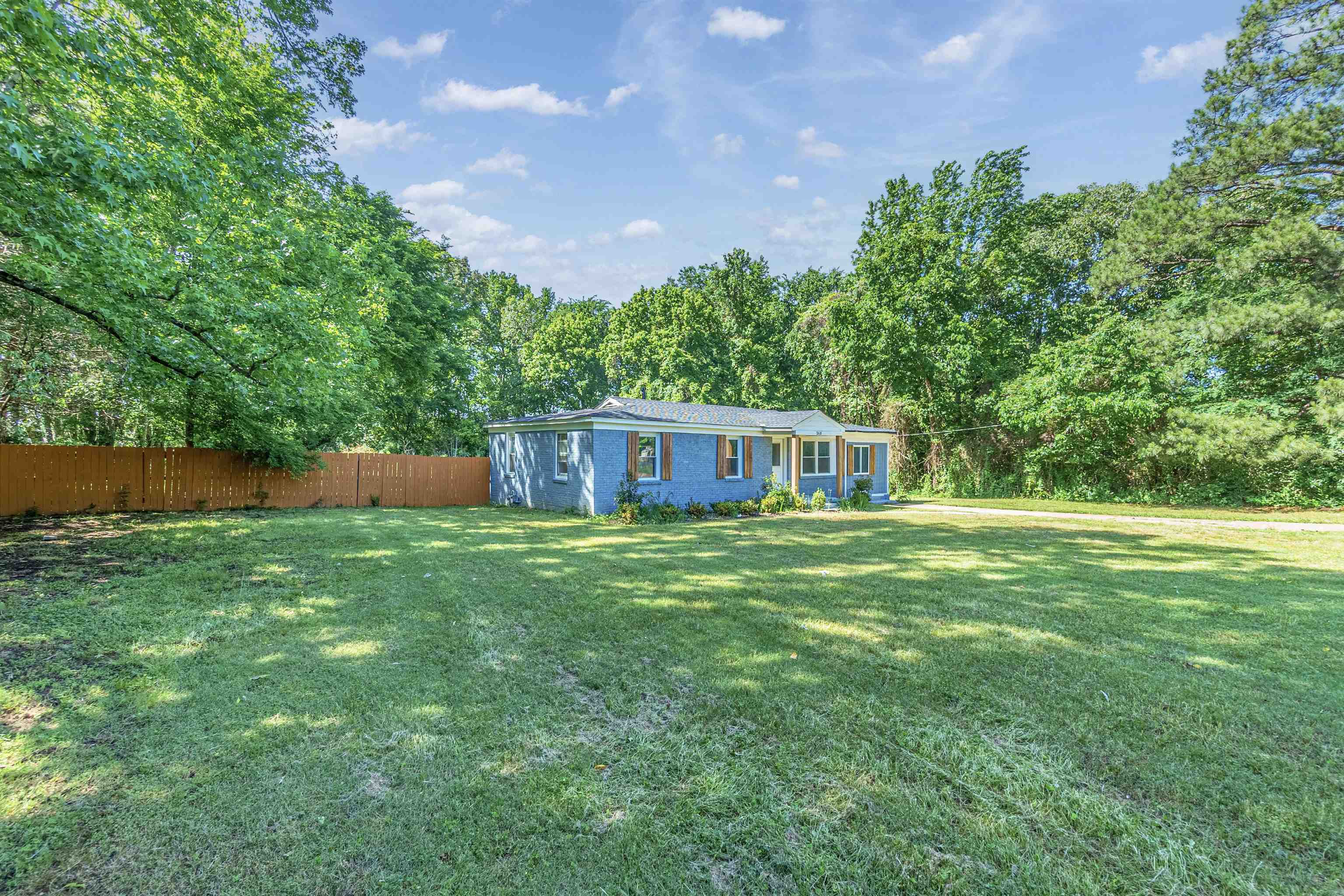 2631 Berryhill Road Memphis, TN 38016 - Photo 2 of 17 a front view of a house with a garden