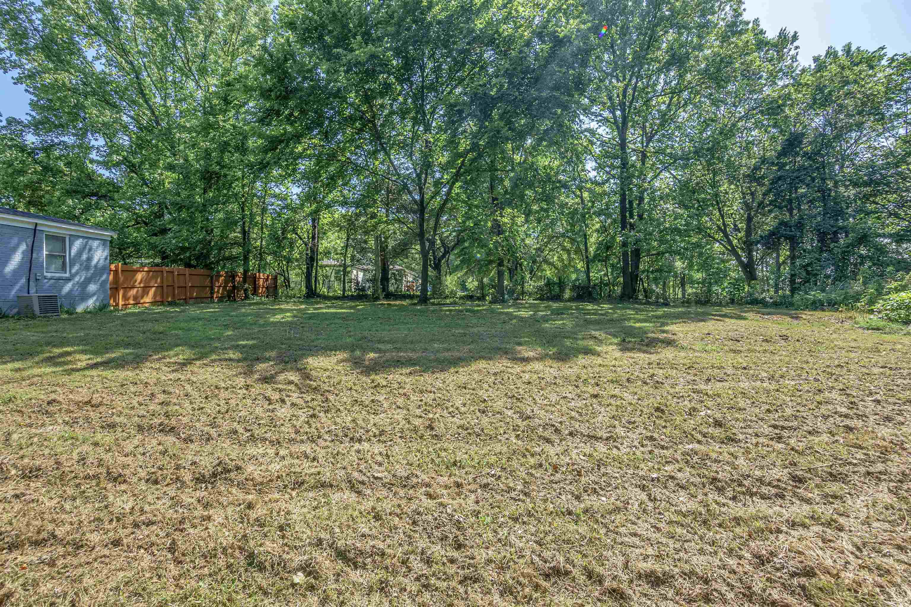 2631 Berryhill Road Memphis, TN 38016 - Photo 4 of 17 a view of a backyard with large trees