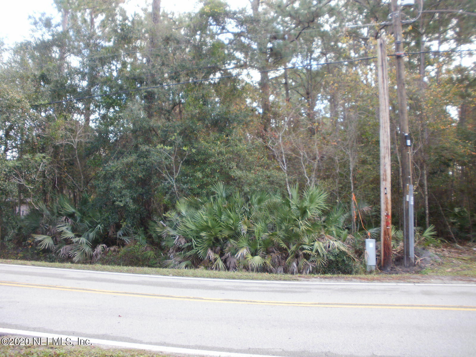 2259 Cortez Road Jacksonville, FL 32246 - Photo 4 of 8 a view of a house and a yard from a window