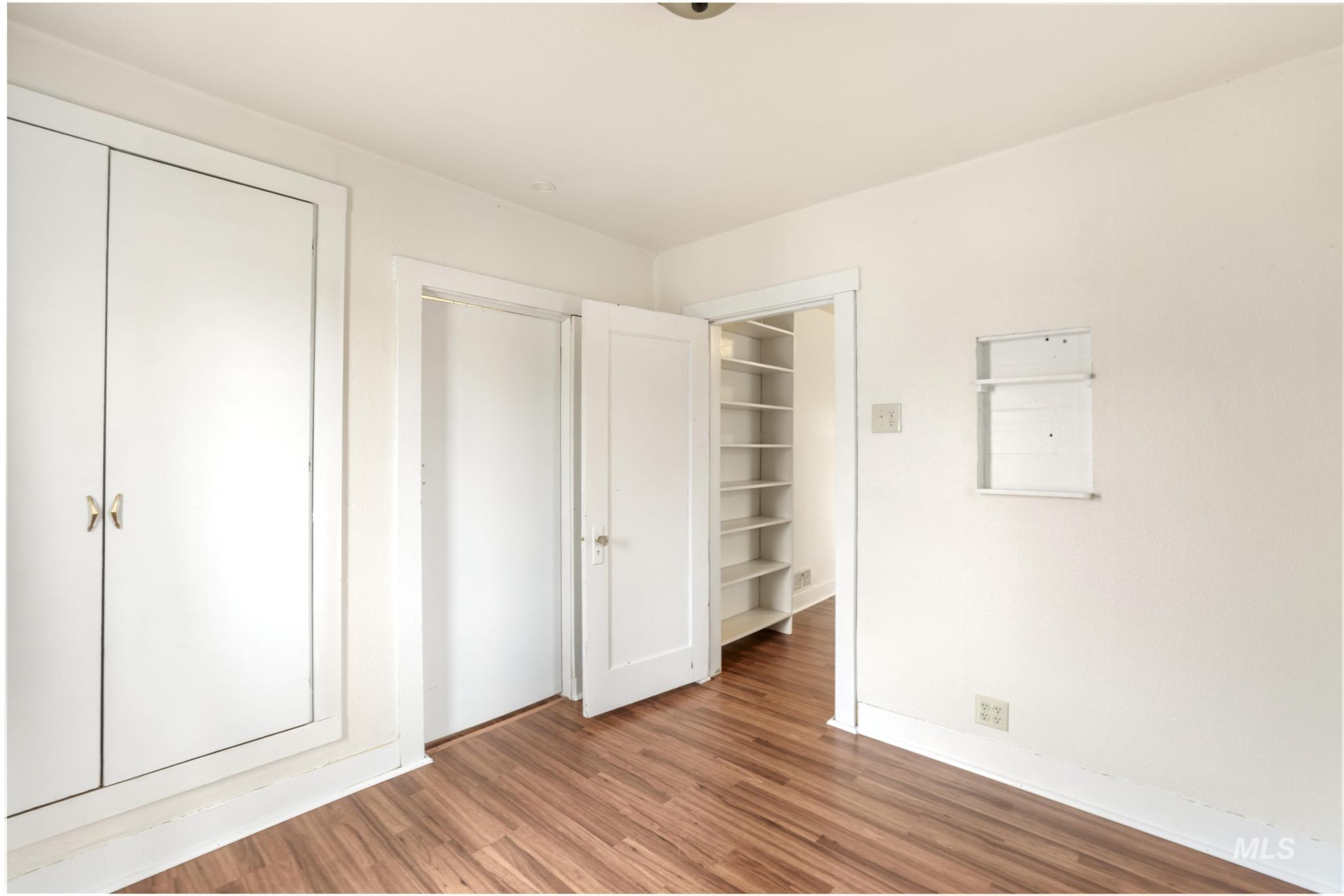 250 Elm Street Twin Falls, ID 83301 - Photo 23 of 28 Unfurnished bedroom with a closet and wood finished floors