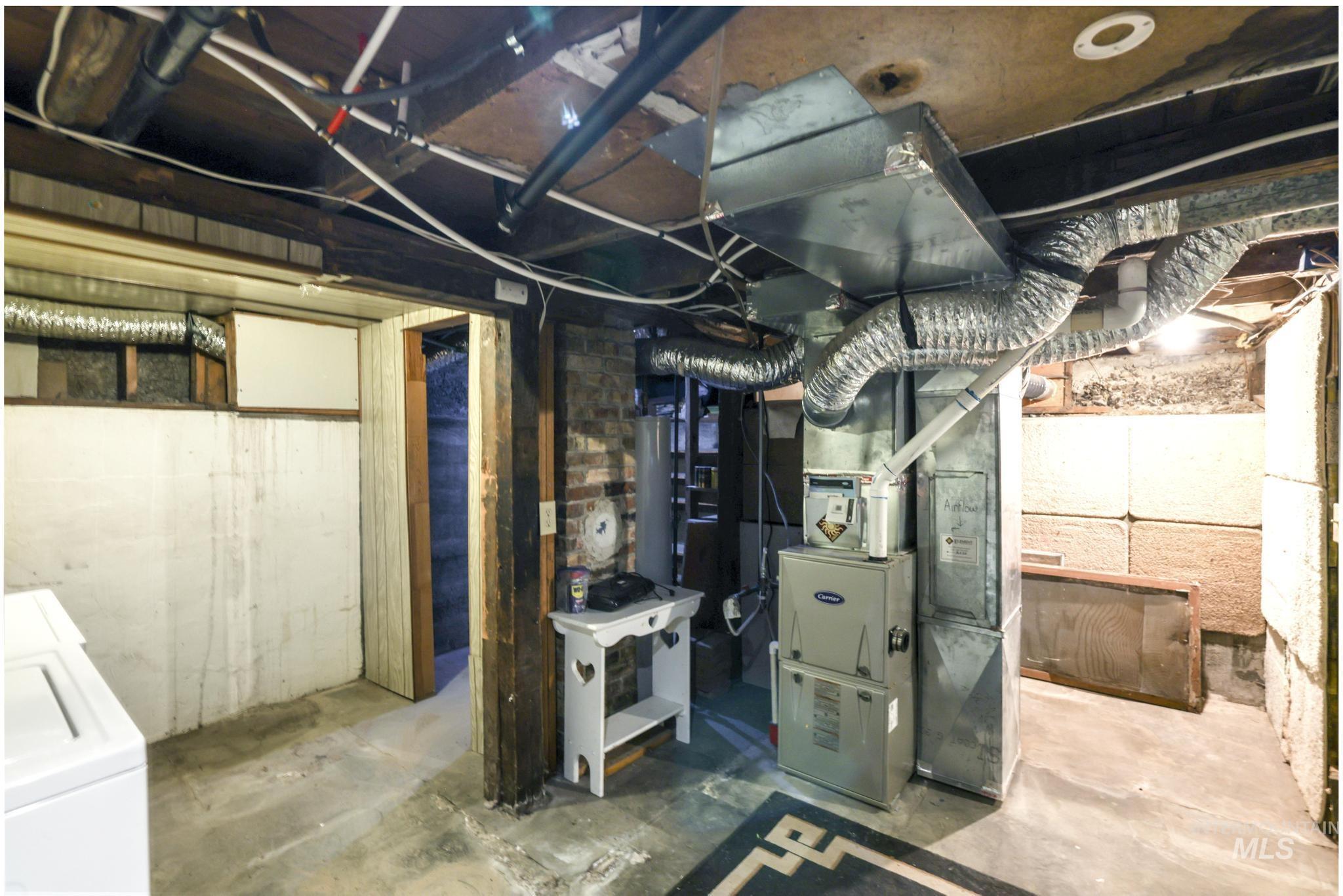 250 Elm Street Twin Falls, ID 83301 - Photo 24 of 28 Unfinished below grade area with washer and dryer and water heater