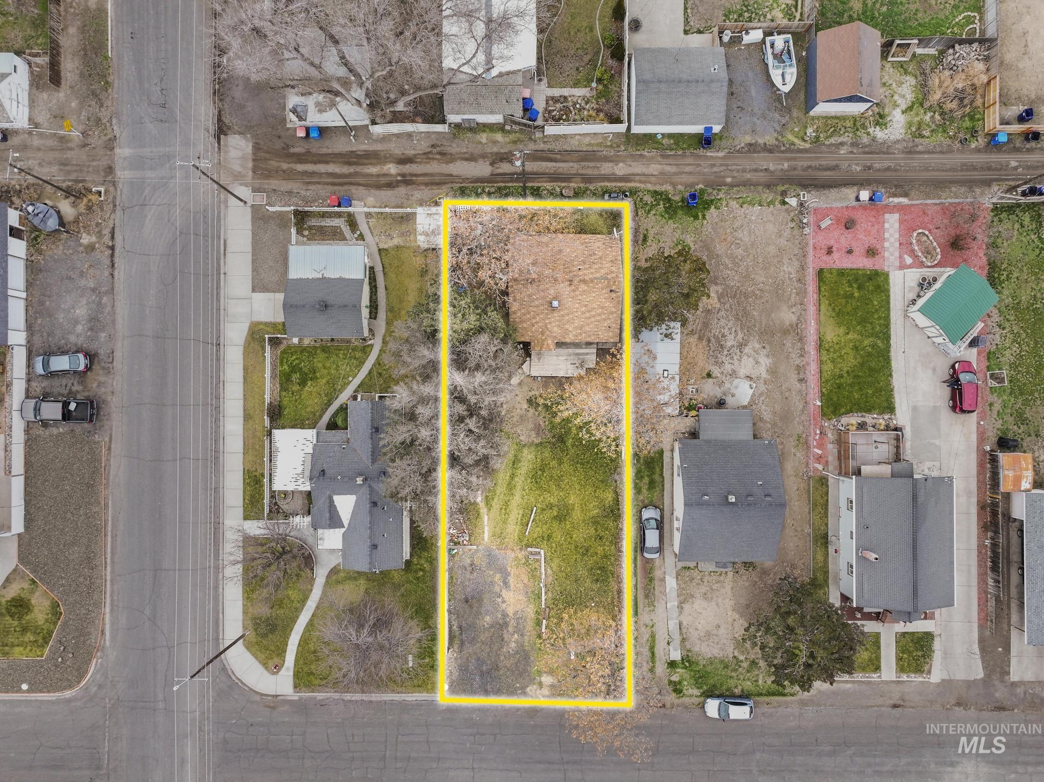 250 Elm Street Twin Falls, ID 83301 - Photo 3 of 28 Aerial perspective of suburban area featuring property boundaries highlighted