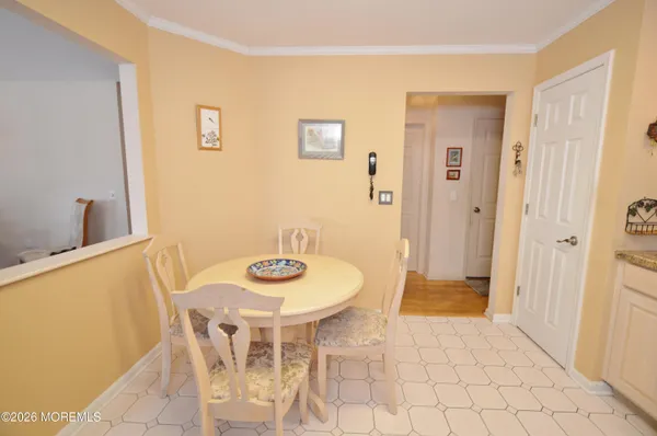 a kitchen with a sink a stove a refrigerator and black cabinets