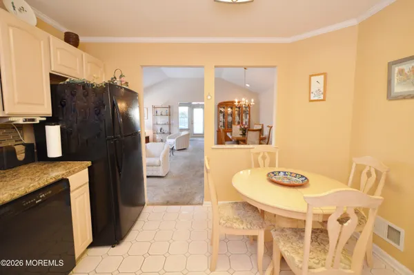 a kitchen with stainless steel appliances granite countertop a stove a microwave and a refrigerator