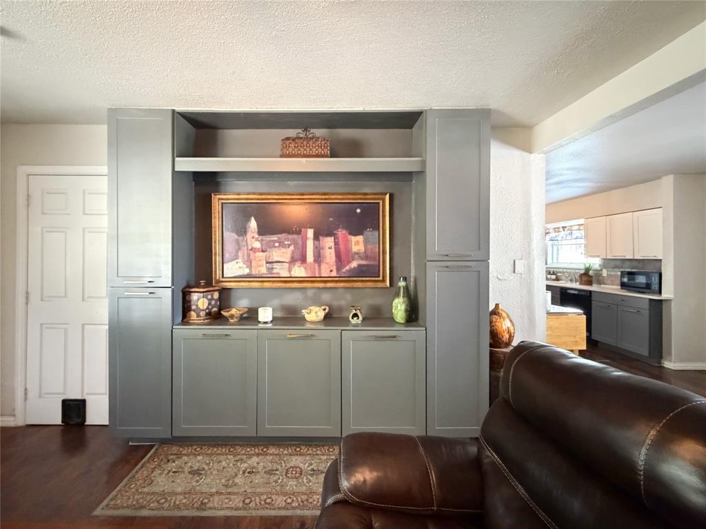 2243 Inca Drive Dallas, TX 75216 - Photo 4 of 24 Custom built-in cabinets are the perfect place for art or flat screen.
