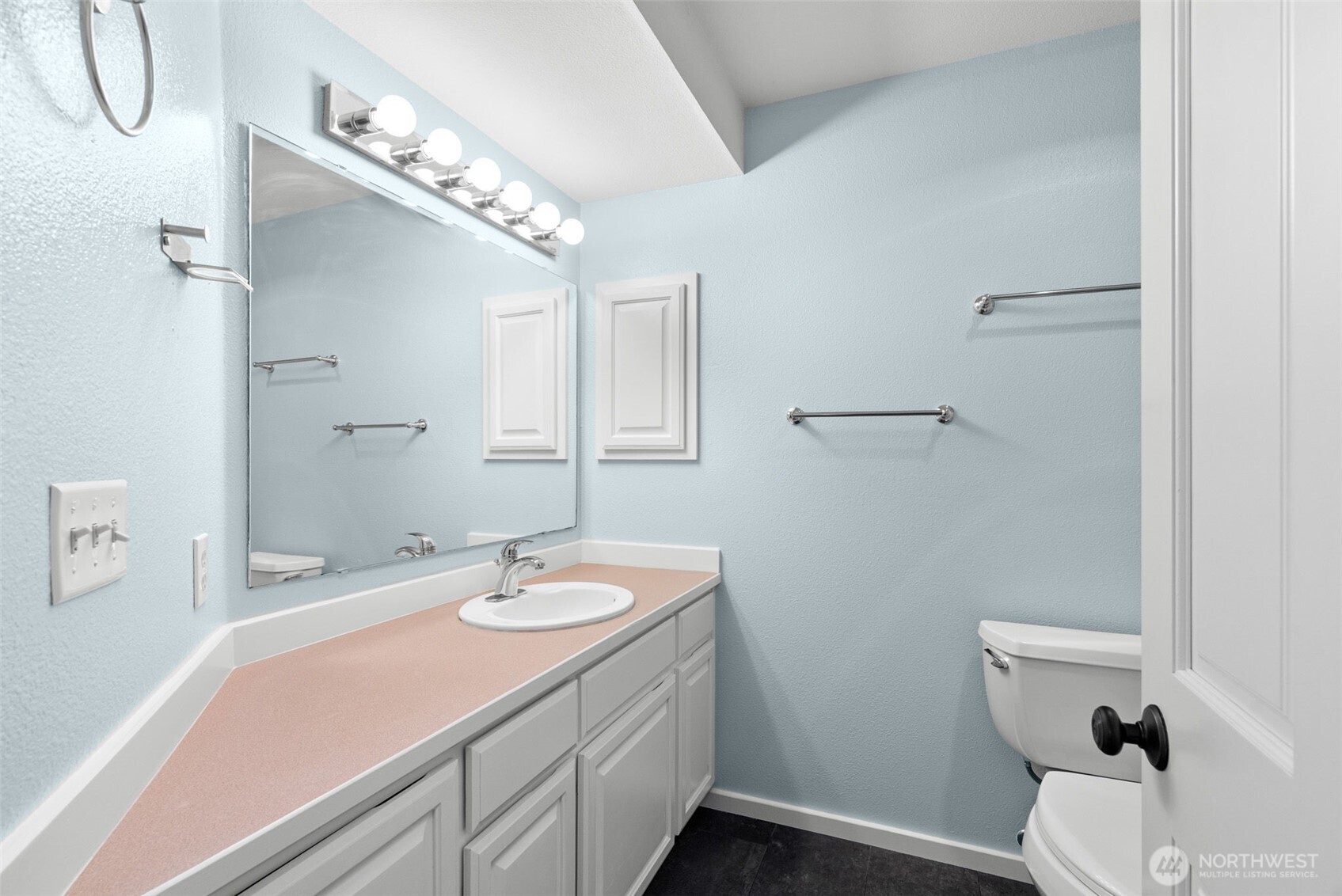 26227 Montera Loop Northeast Kingston, WA 98346 - Photo 17 of 22 a bathroom with a sink a toilet and a mirror