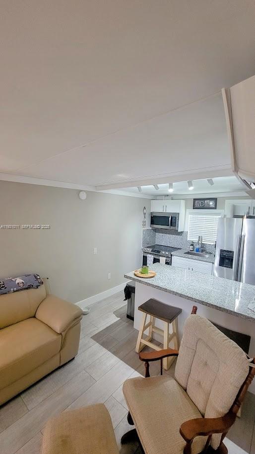 1339 Old Lakeport Road Northwest Moore Haven, FL 33471 - Photo 15 of 17 a living room with furniture and a table