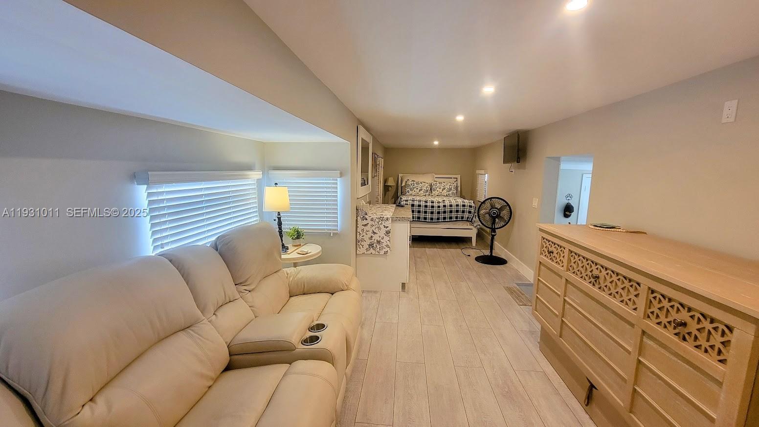 1339 Old Lakeport Road Northwest Moore Haven, FL 33471 - Photo 7 of 17 a living room with furniture and a wooden floor
