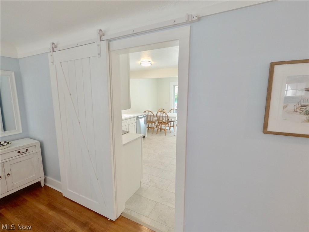 217 Beck Road Avon Lake, OH 44012 - Photo 13 of 18 Hall with a barn door and tile floors