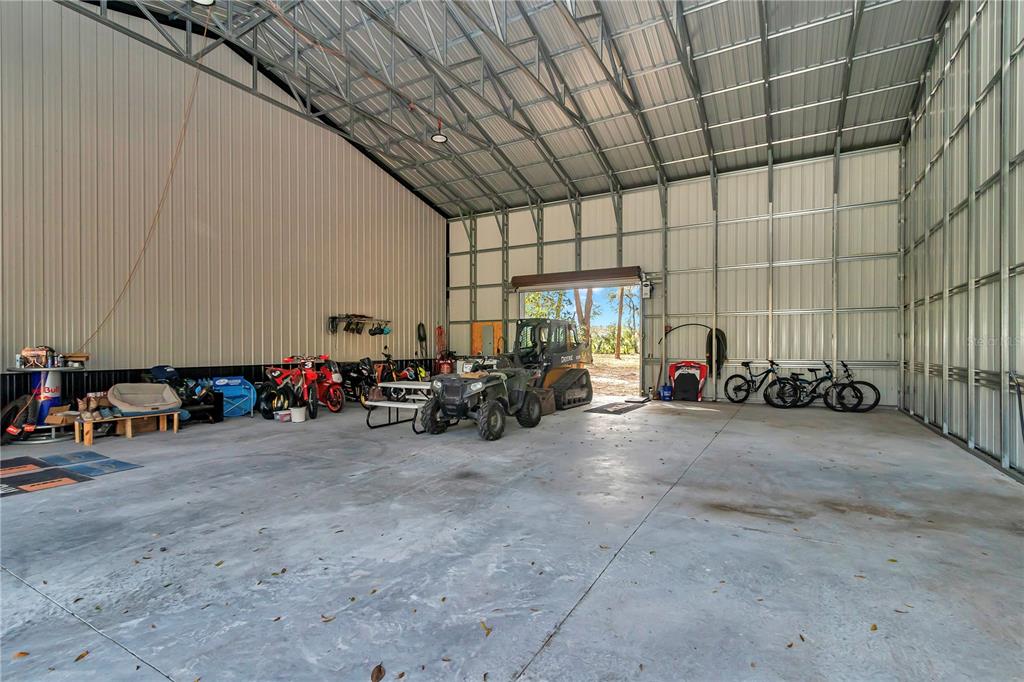 2580 Northeast 140th Street Anthony, FL 32617 - Photo 16 of 25 a view of a garage with cars