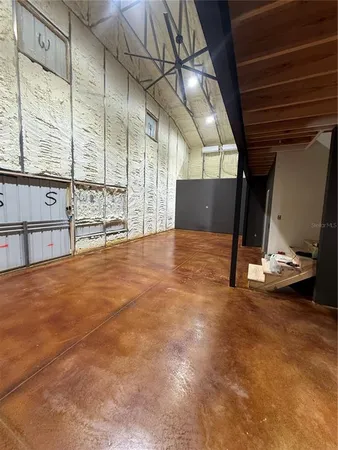 a view of a refrigerator with wooden floor