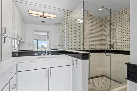 a bathroom with a sink and mirror
