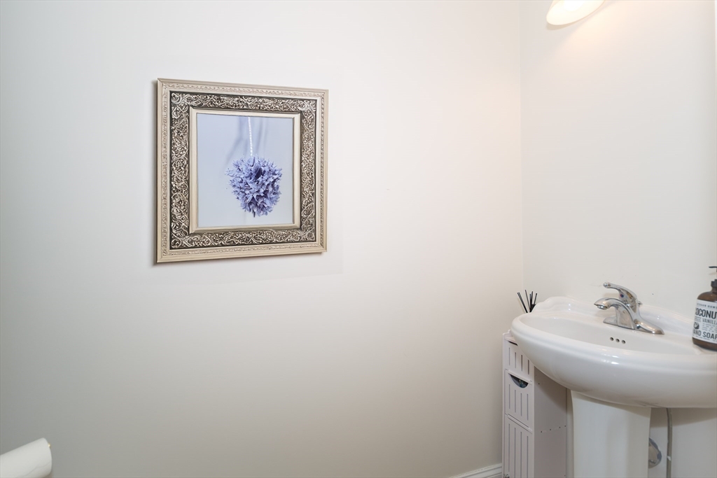 26 Wellesley Avenue, Unit B Natick, MA 01760 - Photo 14 of 34 a bathroom with a sink and a mirror