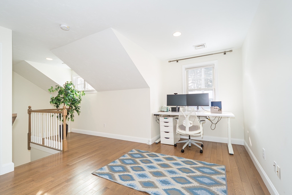 26 Wellesley Avenue, Unit B Natick, MA 01760 - Photo 15 of 34 a workspace with furniture and wooden floor