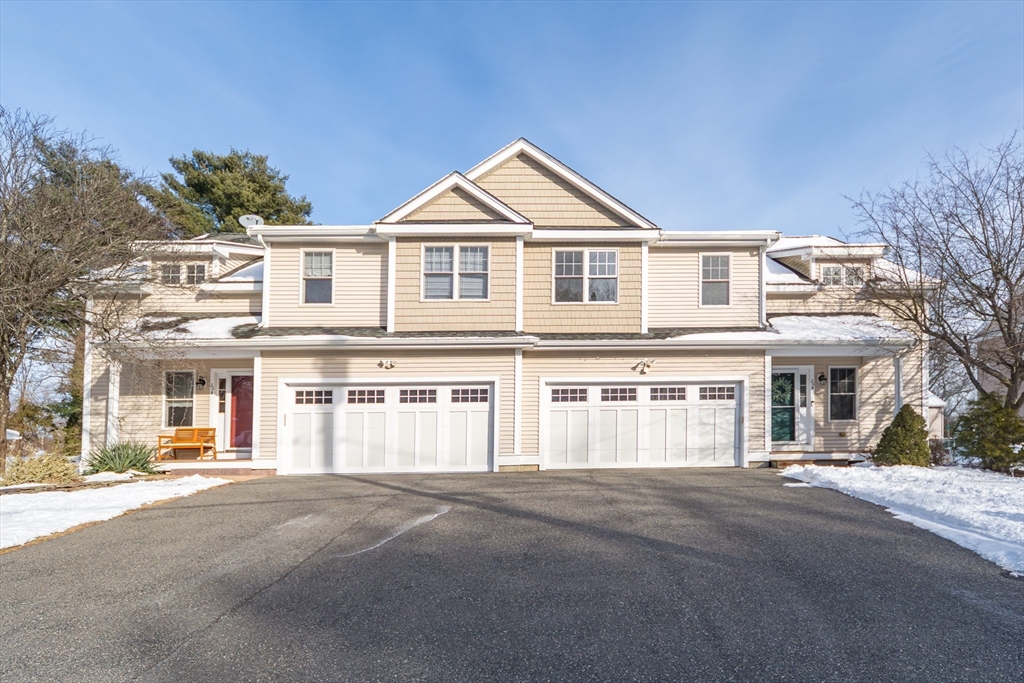 26 Wellesley Avenue, Unit B Natick, MA 01760 - Photo 2 of 34 a front view of a house with a yard
