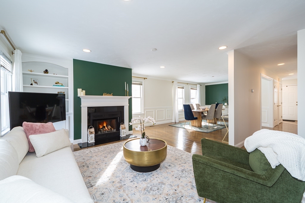 26 Wellesley Avenue, Unit B Natick, MA 01760 - Photo 9 of 34 a living room with furniture and a fireplace