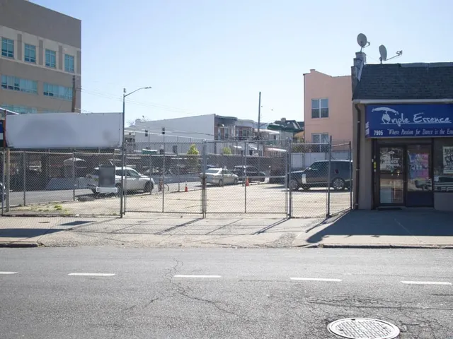 a city street lined with tall buildings