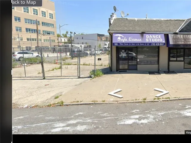 a view of a street with cars