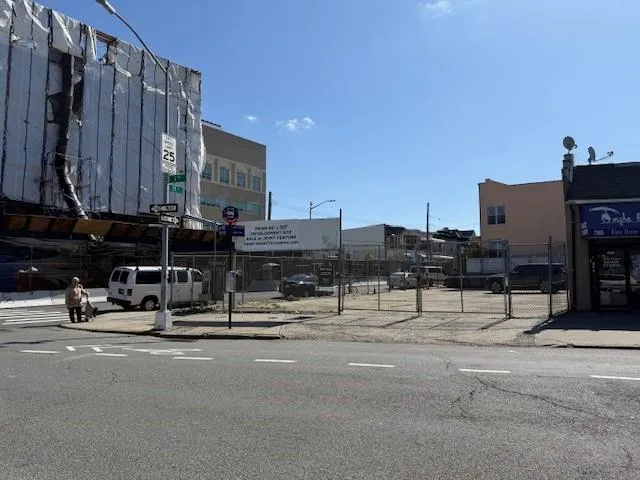 a front view of a building with retail shops