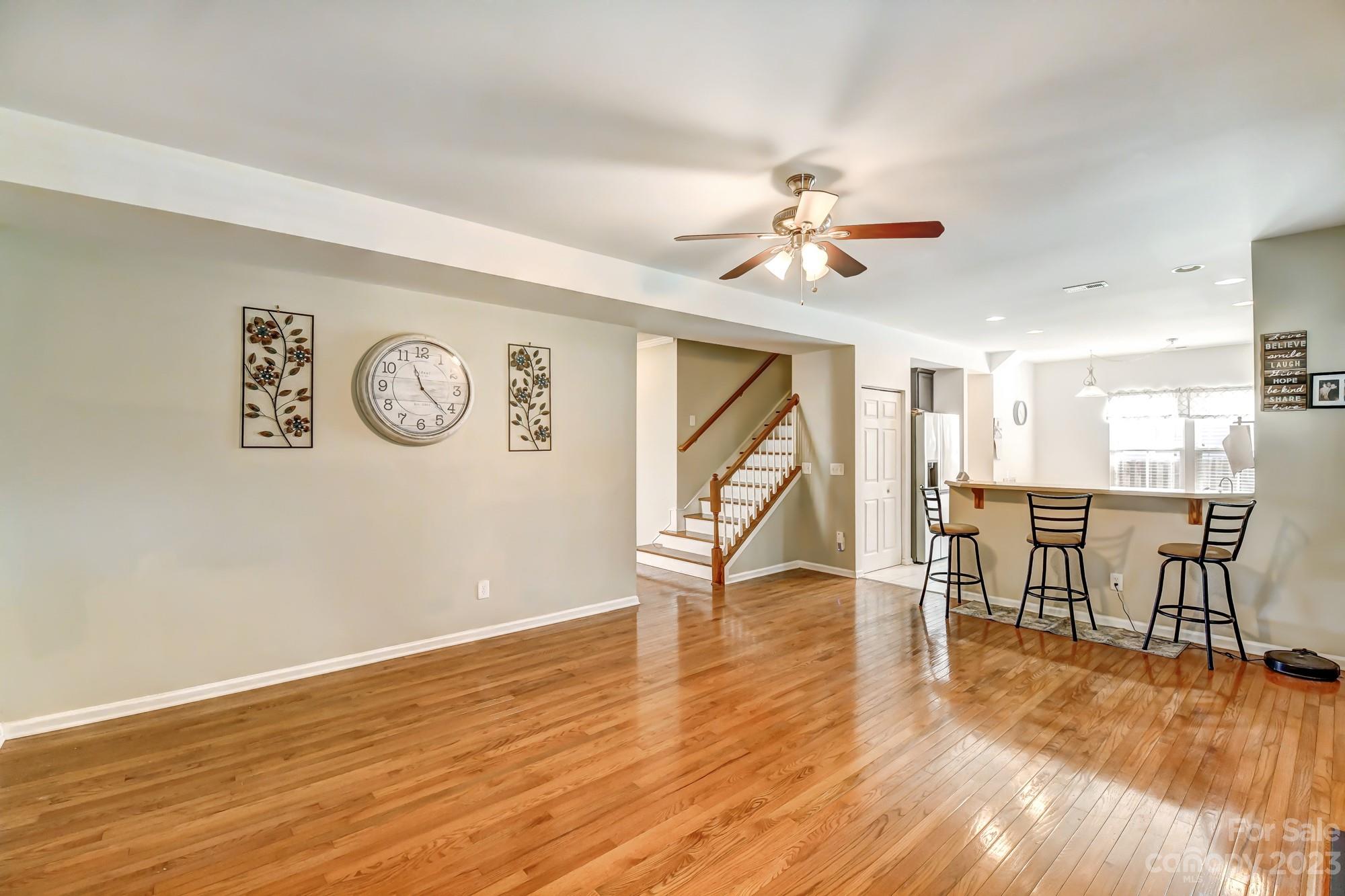 3042 Rhododendron Place Clover, SC 29710 - Photo 11 of 47 a view of a livingroom with furniture a ceiling fan and wooden floor