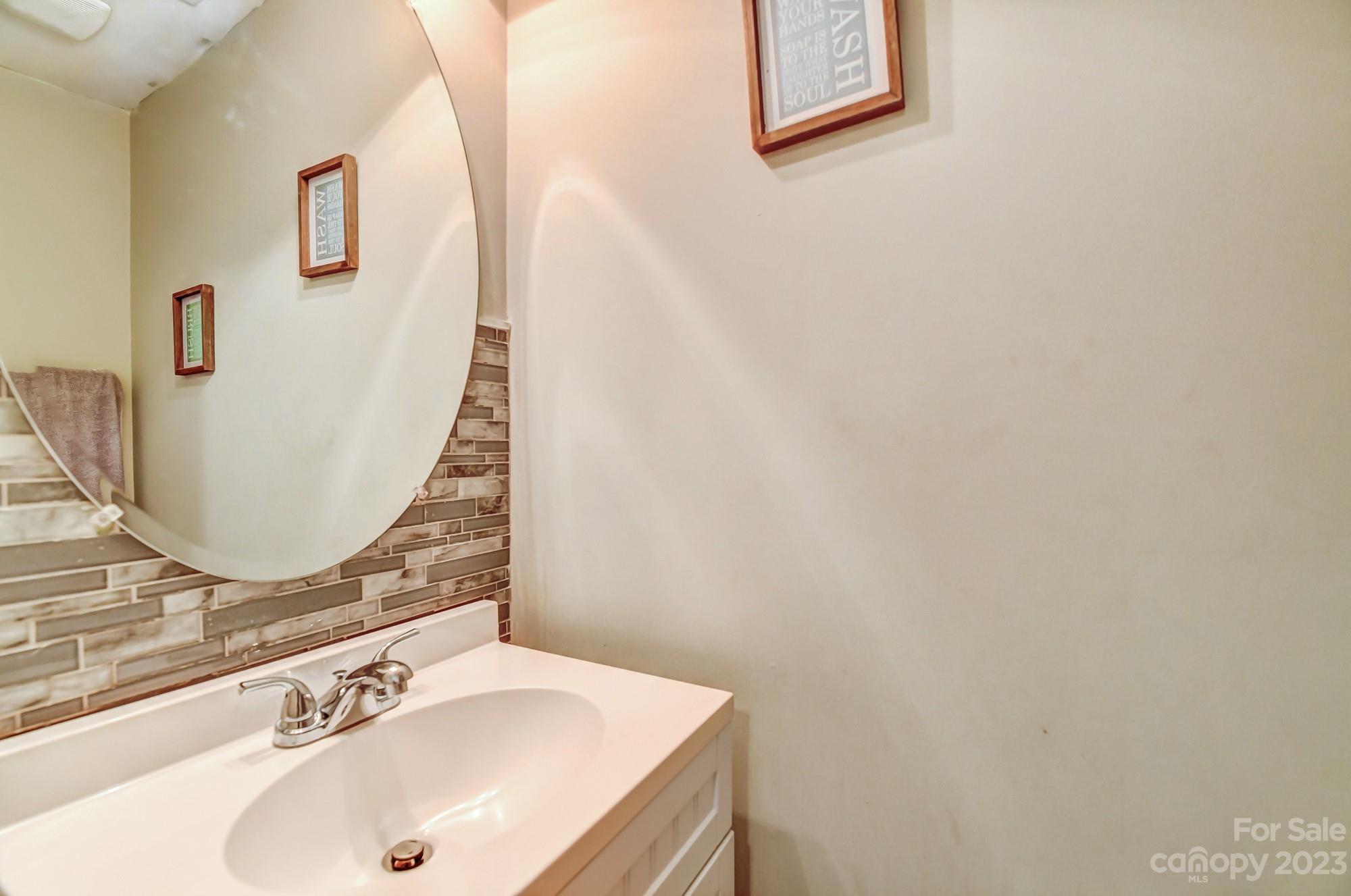 3042 Rhododendron Place Clover, SC 29710 - Photo 24 of 47 a bathroom with a sink and a mirror