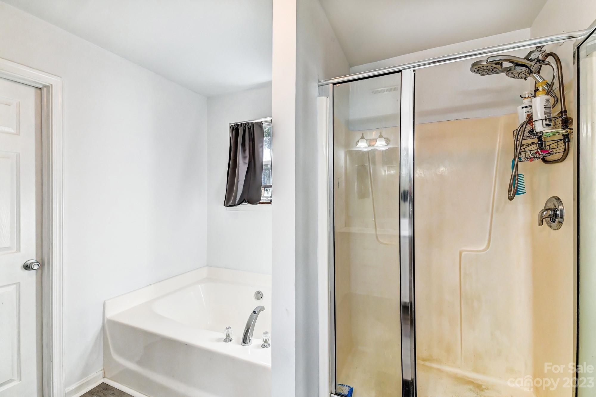 3042 Rhododendron Place Clover, SC 29710 - Photo 33 of 47 a bathroom with a tub and a shower