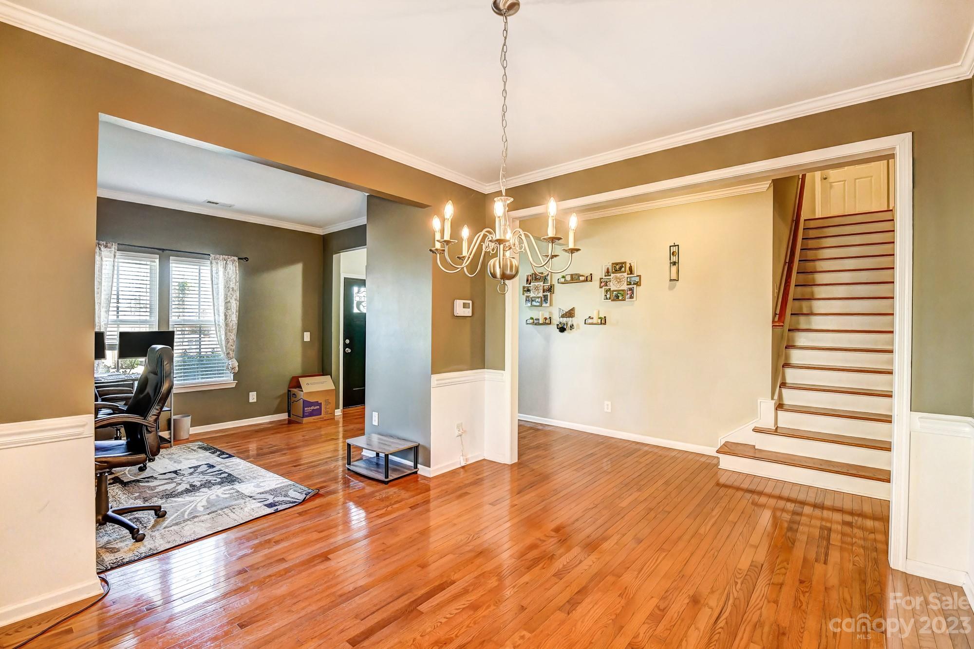 3042 Rhododendron Place Clover, SC 29710 - Photo 9 of 47 a view of a livingroom with wooden floor and a ceiling fan