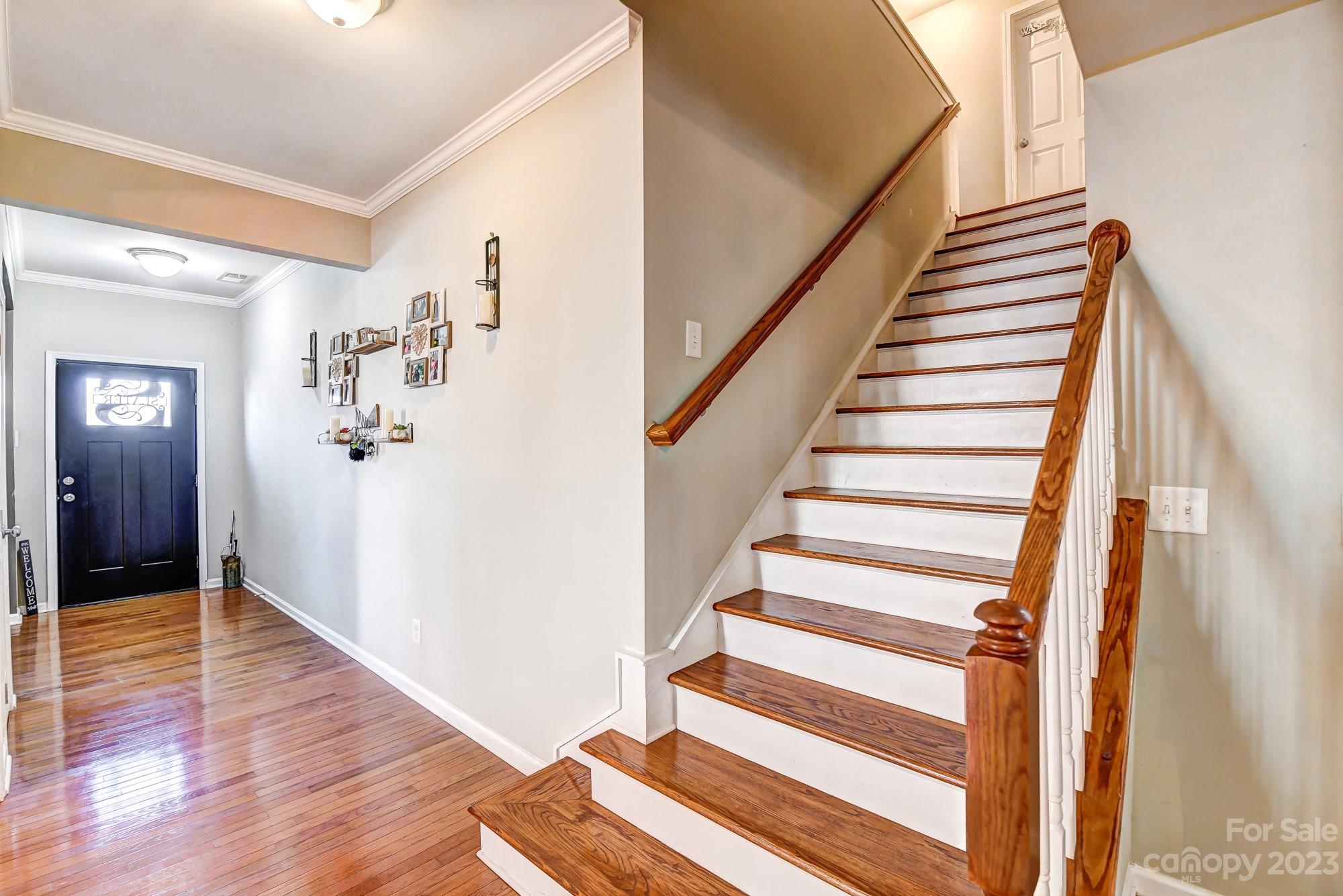 3042 Rhododendron Place Clover, SC 29710 - Photo 10 of 47 a view of an entryway with wooden floor and stairs