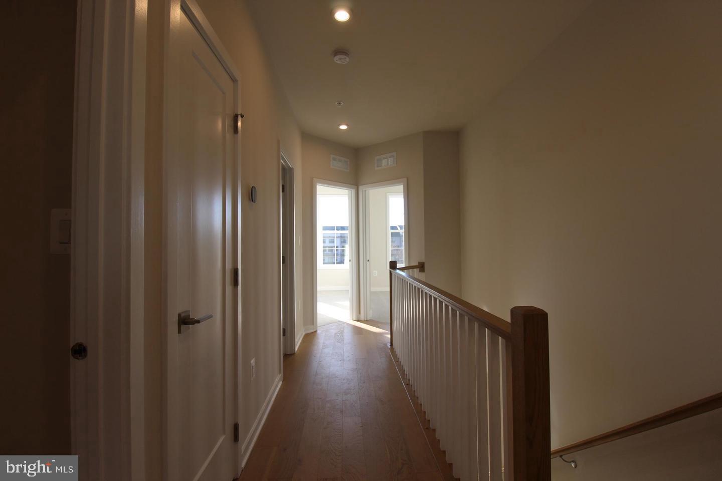 22383 Roanoke Rise Terrace Ashburn, VA 20148 - Photo 17 of 41 a view of hallway with wooden floor