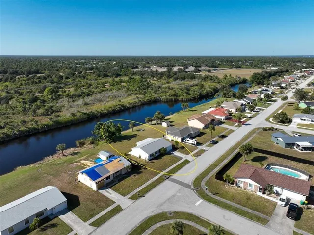 an aerial view of a house with a ocean view