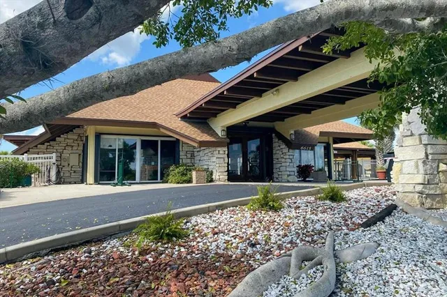 a view of a house with a garden